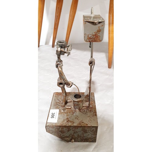 306 - A toilet roll holder sculpture made from nuts and bolts, height 10.75