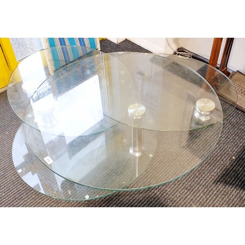 313 - A Dwell extending glass coffee table, diameter 35.5