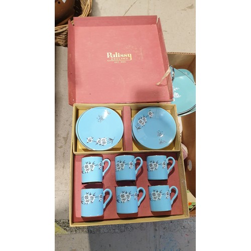 383 - A box of ceramics including a boxed Palissy set of coffee cans and saucers. No shipping. Arrange col... 