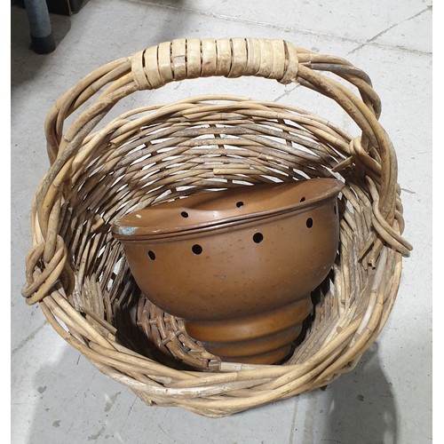 384 - A cane work basket and a copper posser. No shipping. Arrange collection or your own packer and shipp... 