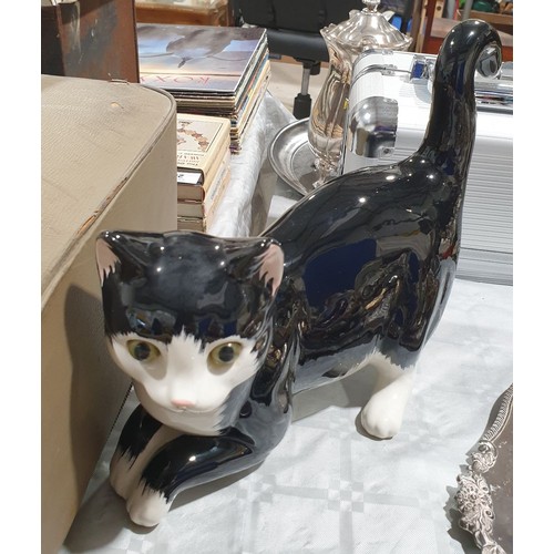 410 - A ceramic cat, height 8.75