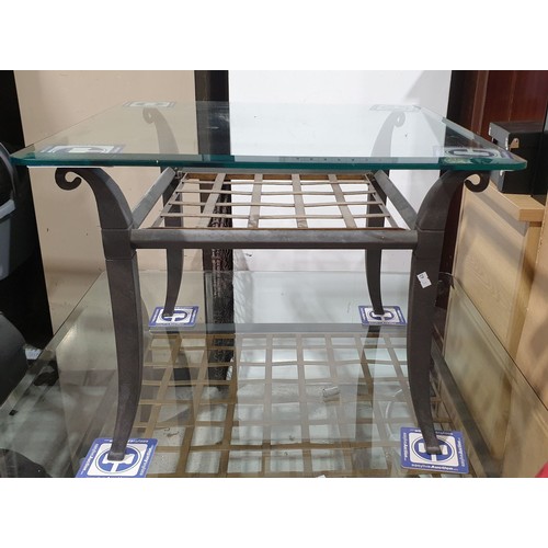 430 - A bevelled glass topped coffee table., 23.5