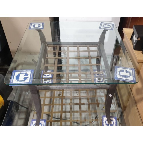 430 - A bevelled glass topped coffee table., 23.5