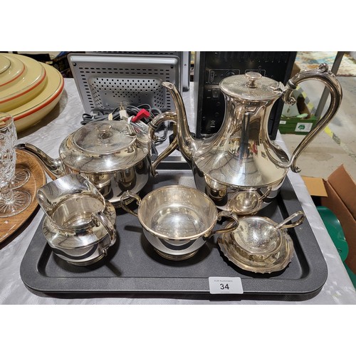 34 - A four piece silver plated tea set by James Dixon & Sons, Sheffield together with a silver plated te... 