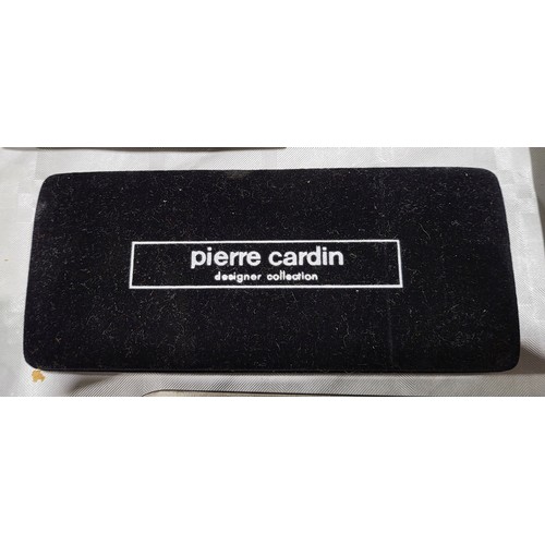 404 - A set of four boxed Pierre Cardin earrings. UK shipping £14.