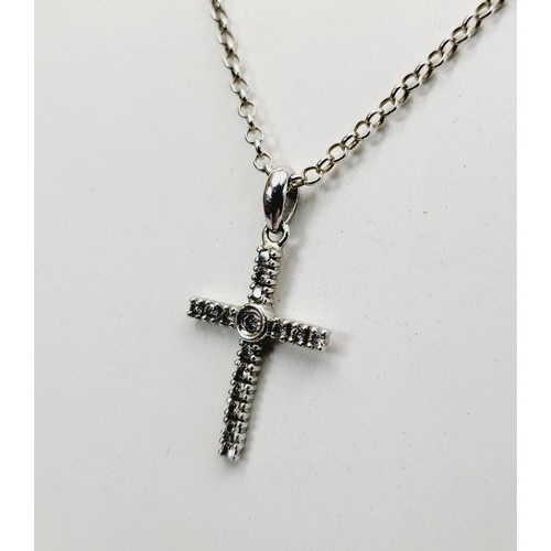 378 - A hallmarked 9ct white gold cross pendant set with diamonds together with a 925 silver chain, cross ... 