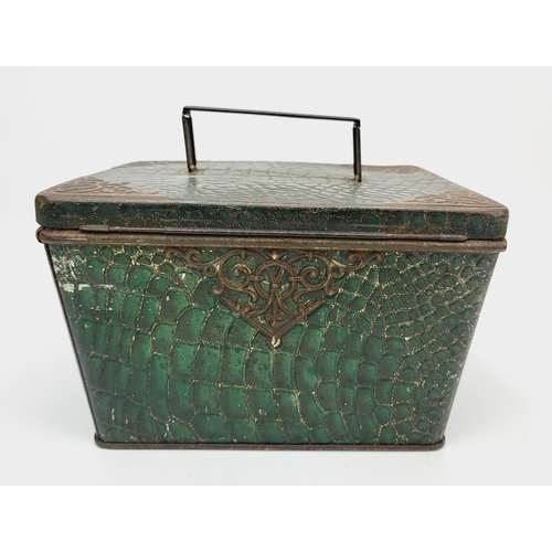 267A - An antique Huntley & Palmers Morocco green biscuit tin with a faux crocodile skin pattern finish, c.... 