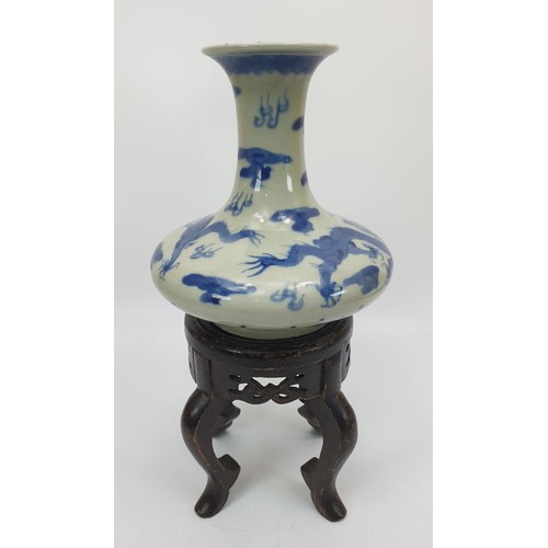 125 - A Chinese blue and white dragon vase having six character mark to the base, height 6