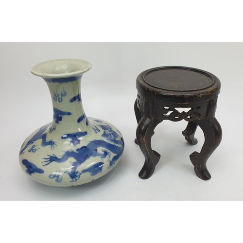 125 - A Chinese blue and white dragon vase having six character mark to the base, height 6