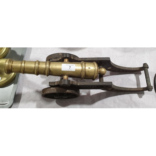 7 - A vintage cast iron and brass model of a canon, length 18.5