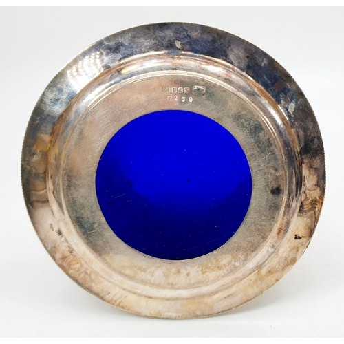 9 - A silver plated lidded pierce work canister with internal glass blue liner, height 5.5