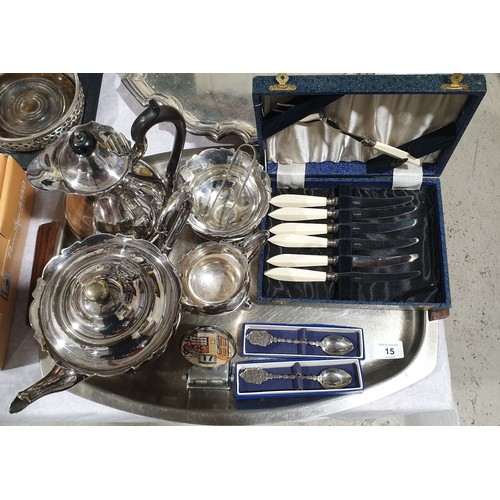 15 - A four piece silver plated tea set, cased flatware and a desk calendar. UK shipping £14.