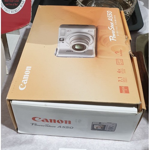 16 - A boxed Canon PowerShot A550 camera, working order. UK shipping £14.