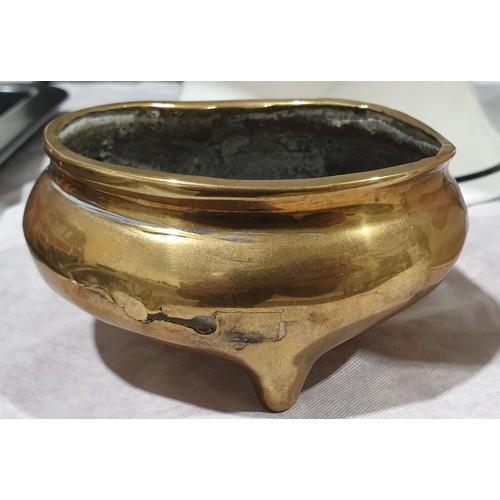23 - An antique brass censor with marks to the base, A/F, diameter 4