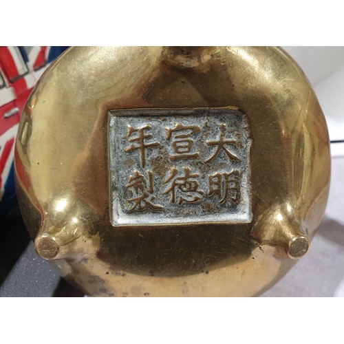 23 - An antique brass censor with marks to the base, A/F, diameter 4