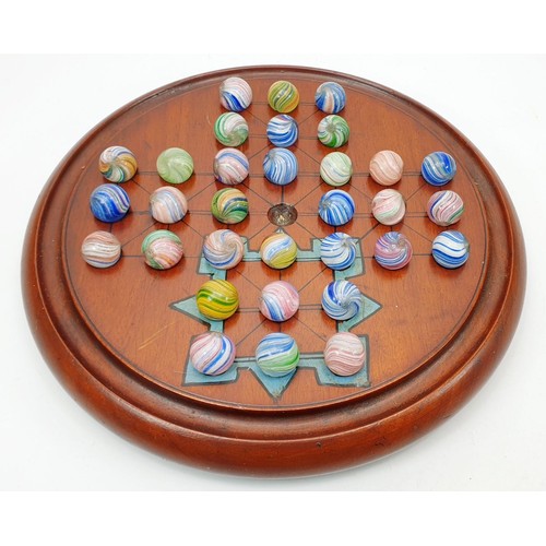 127 - A vintage solitaire with onion skin marbles, each marble 2cm together with a wooden marble box. UK s... 