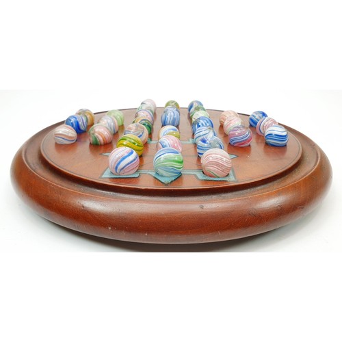127 - A vintage solitaire with onion skin marbles, each marble 2cm together with a wooden marble box. UK s... 