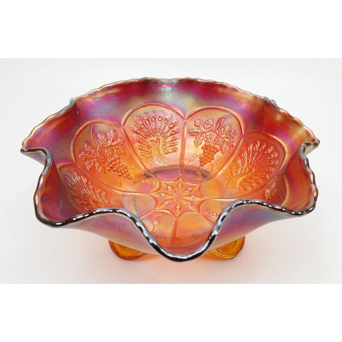 130 - A scarce Peacock and Grape red carnival glass bowl, diameter 7.75