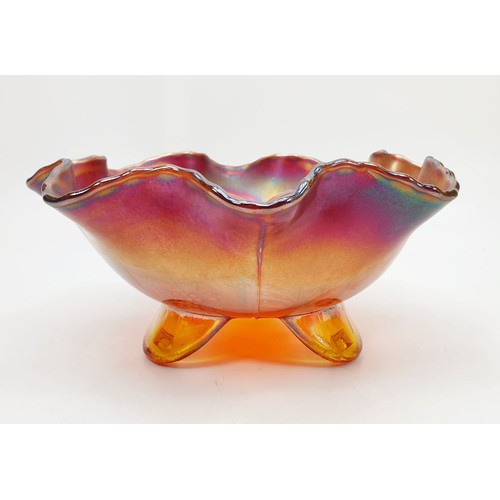 130 - A scarce Peacock and Grape red carnival glass bowl, diameter 7.75
