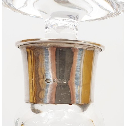 132 - A cut glass decanter with a hallmarked silver collar, Birmingham 1975, height11.5