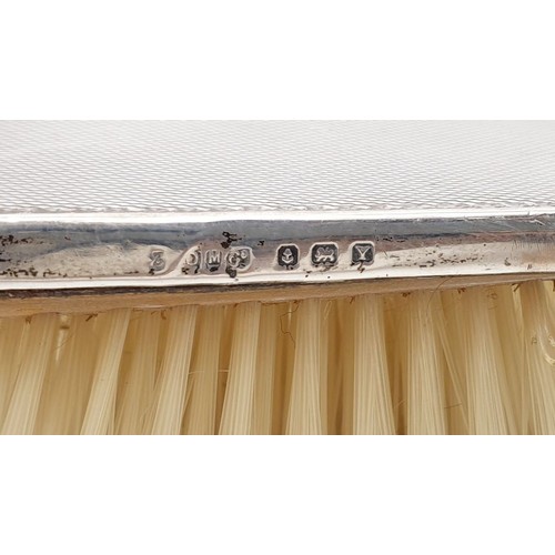139 - Two hallmarked silver backed dressing table brushes, Birmingham 1918 and 1948. UK shipping £14.