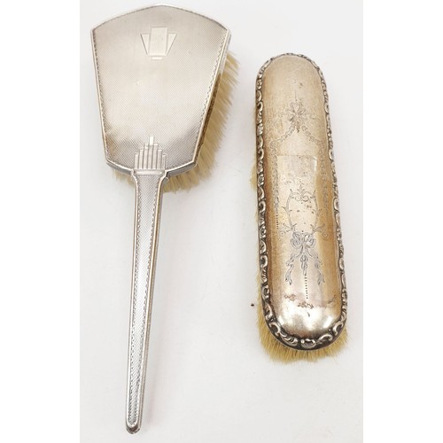 139 - Two hallmarked silver backed dressing table brushes, Birmingham 1918 and 1948. UK shipping £14.