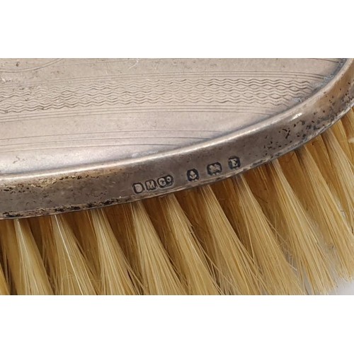 140 - A hallmarked silver backed dressing table brush and mirror set, Birmingham 1929 and 1930. UK shippin... 