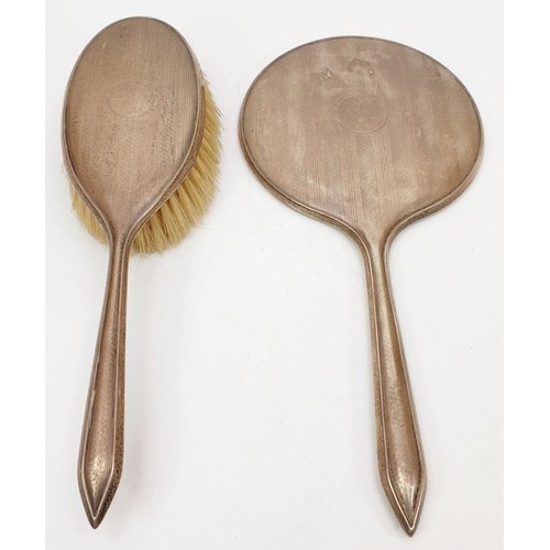 140 - A hallmarked silver backed dressing table brush and mirror set, Birmingham 1929 and 1930. UK shippin... 