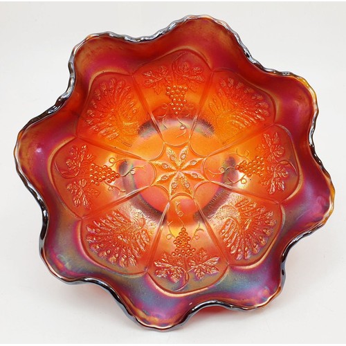 130 - A scarce Peacock and Grape red carnival glass bowl, diameter 7.75