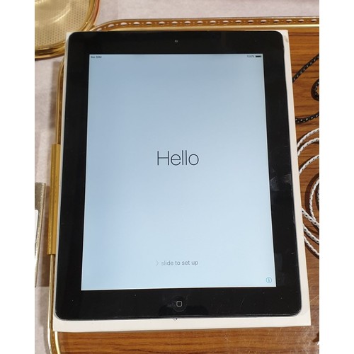 32 - An Apple iPad 2 16GB together with accessories. UK shipping £14.