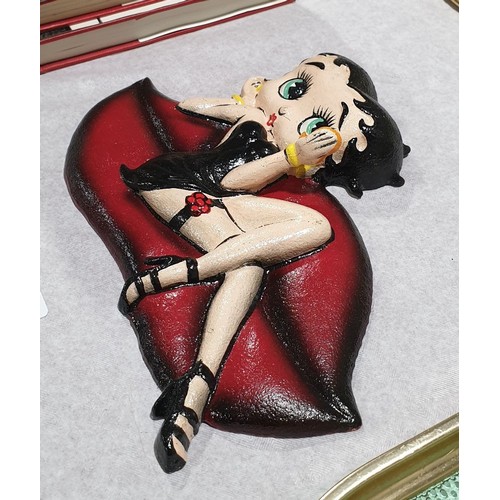 40 - A cast iron Betty Boop wall plaque, width 7.5