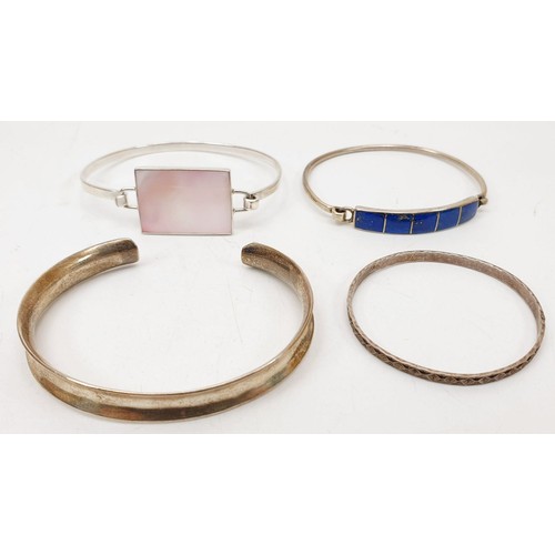 161 - Four silver bangles and two silver bracelets, gross weight 67g. UK shipping £14.