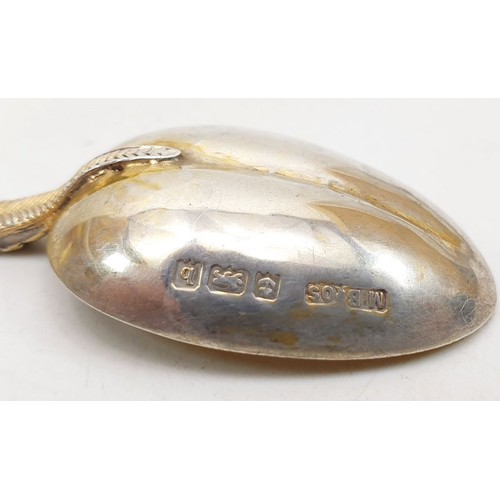 153 - A hallmarked silver replica of The Anointing Spoon, London 1901 together with a hallmarked silver Ap... 