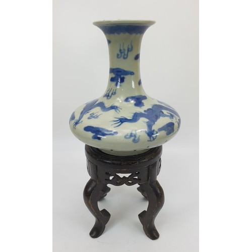 219 - A Chinese blue and white dragon vase having six character mark to the base, height 6