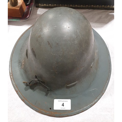 4 - A WWII steel helmet, dated 1941. UK shipping £14.