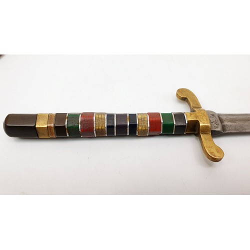 6 - A 19th century dagger, the handle composed of coloured bone segments, overall length 10.5