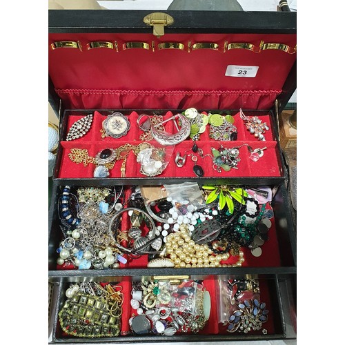 23 - A jewellery box and contents. UK shipping £14.