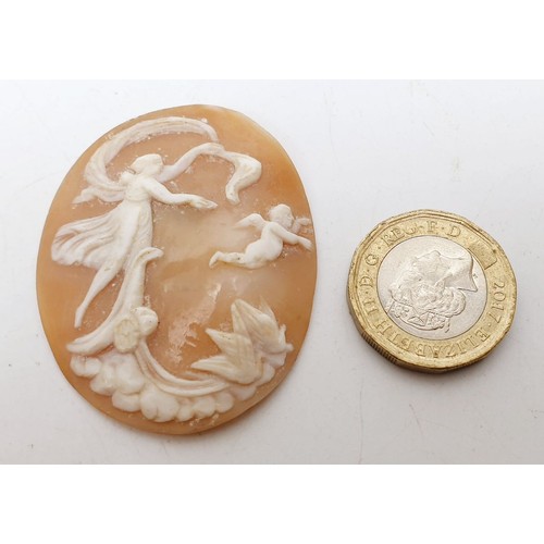 226 - An antique carved shell cameo depicting Eros And Psyche, length 1.75