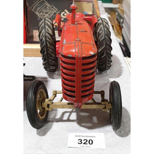 320 - A vintage model of a Massey-Harris 745D tractor, length 8