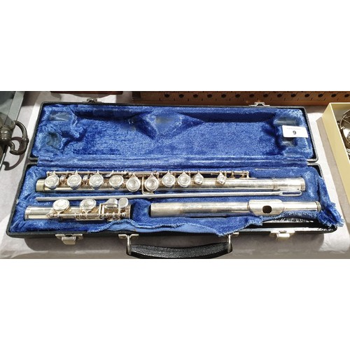 9 - A cased Emerson flute. UK shipping £14.