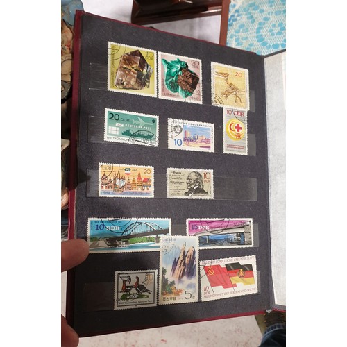 22 - Two stamp albums. UK shipping £14.