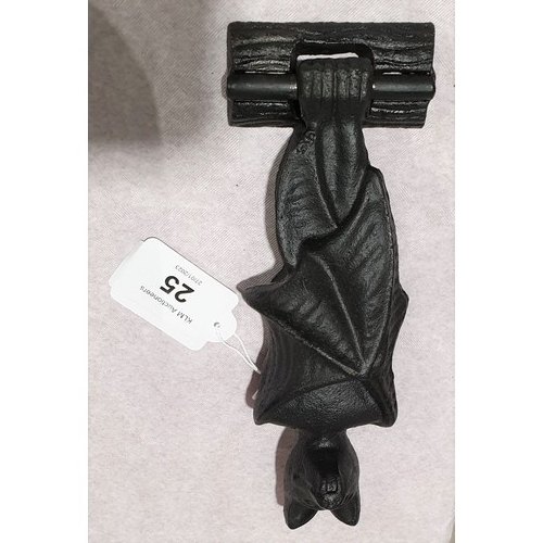 25 - A cast iron door knocker in the form of a bat, length 7