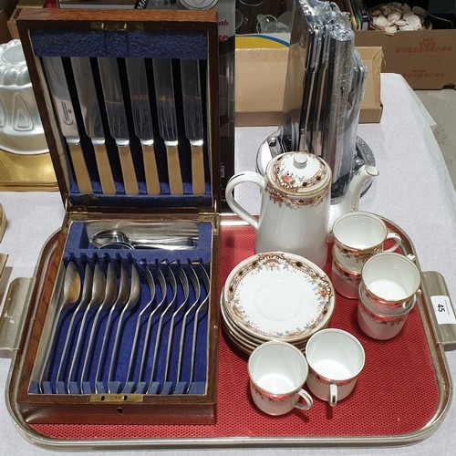 45 - A vintage oak canteen of cutlery together with an early 20th century part coffee service. No shippin... 