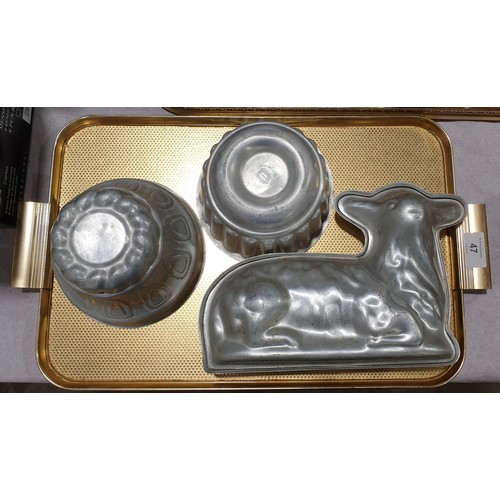 47 - Three vintage aluminium food moulds including a lamb. UK shipping £14.