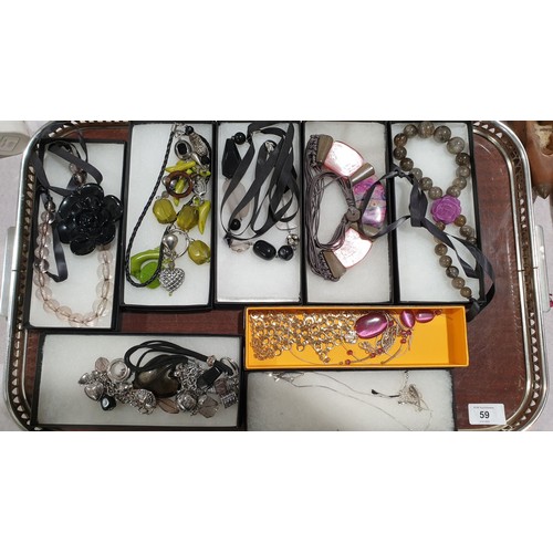 59 - A selection of boxed costume jewellery necklaces. UK shipping £14.