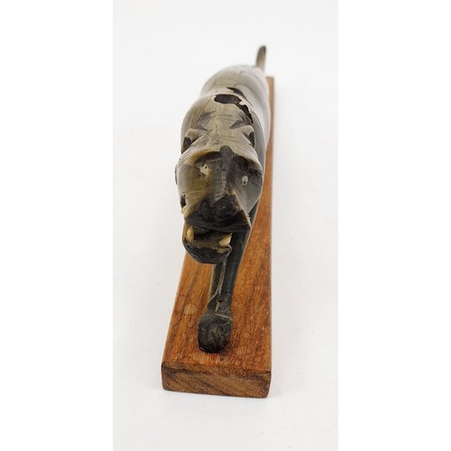 192 - A vintage carving of a jaguar, length 8.75