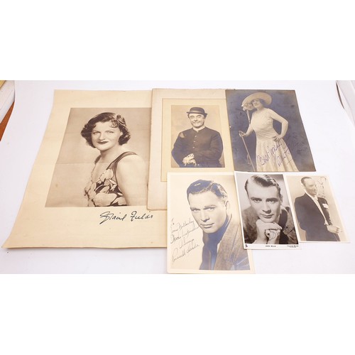 194 - A selection of vintage signed, printed signed and unsigned photographs including ink signed John Mil... 