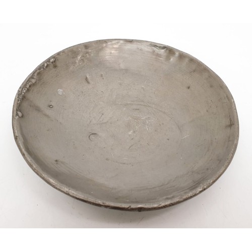 370 - An Chinese dish carved coconut shell dish with Buddhist motifs and lined with pewter, diameter 4.75