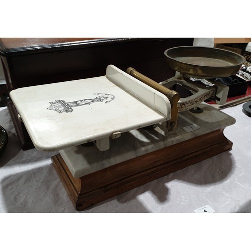 5 - A set of antique J. White & Son scales, with white ceramic bed, central brass handle, marble and oak... 