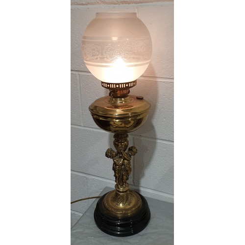 13 - A vintage brass table lamp in the form of an oil lamp, height 26.5